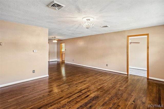2407 Birchwood Rd, Henrico, VA 23294 - unfurnished room featuring wood finished floors, a chandelier, a textured ceiling, and a baseboard radiator
