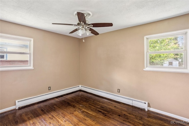 2407 Birchwood Rd, Henrico, VA 23294 - spare room featuring baseboard heating, dark wood-type flooring, a ceiling fan, and a textured ceiling