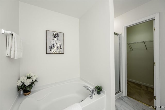915 Jamerson Ln, Glen Allen, VA 23059 - bathroom with a bath, a shower stall, and a spacious closet
