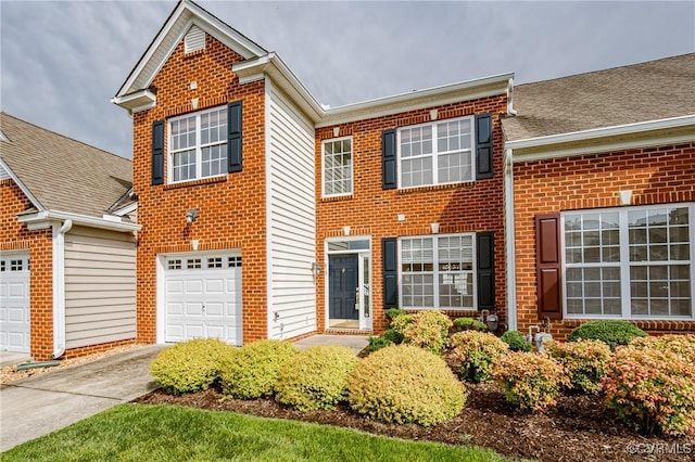 915 Jamerson Ln, Glen Allen, VA 23059 - traditional-style home featuring brick siding, concrete driveway, and roof with shingles