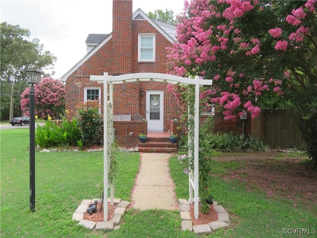 5900 River Rd, South Chesterfield, VA 23803 - view of front of house with a chimney and brick siding
