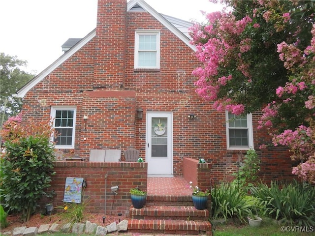5900 River Rd, South Chesterfield, VA 23803 - traditional-style house featuring a chimney and brick siding