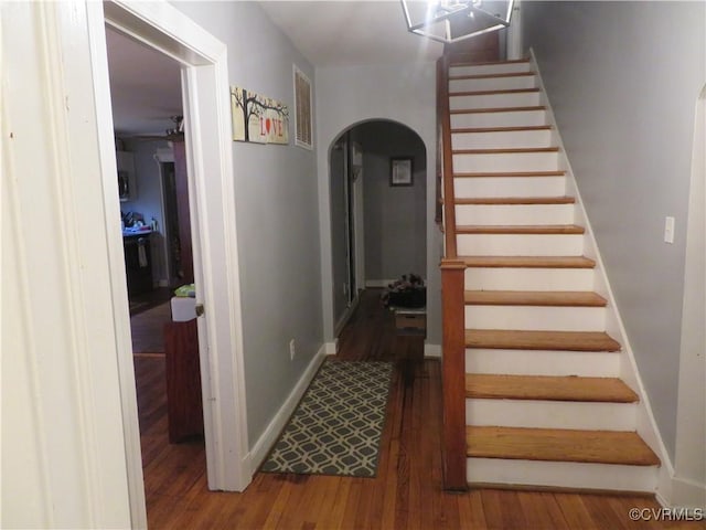 5900 River Rd, South Chesterfield, VA 23803 - stairway with arched walkways, wood finished floors, and ceiling fan