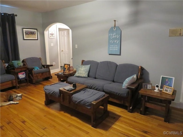 5900 River Rd, South Chesterfield, VA 23803 - living room featuring arched walkways and light wood finished floors