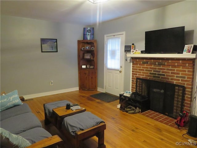 5900 River Rd, South Chesterfield, VA 23803 - living room featuring a fireplace and wood finished floors