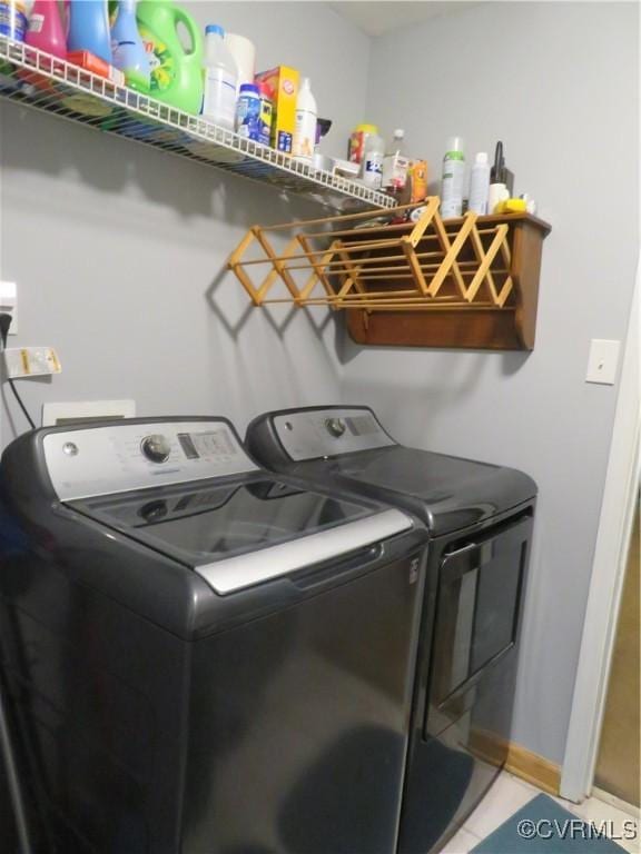 5900 River Rd, South Chesterfield, VA 23803 - laundry room with washer and clothes dryer and light tile patterned floors