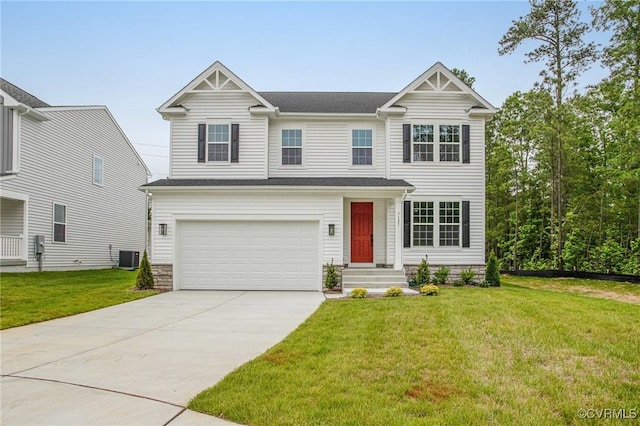 7127 Braxton Ct, Ladysmith, VA 22546 - view of front facade with driveway, an attached garage, a front yard, and stone siding