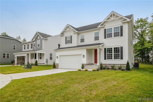 7127 Braxton Ct, Ladysmith, VA 22546 - view of front of house featuring driveway, an attached garage, and a front lawn
