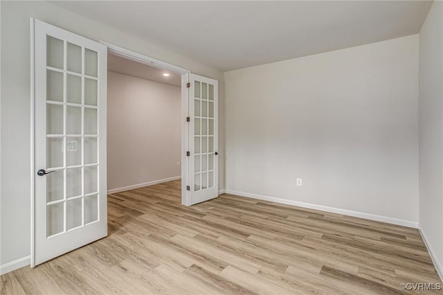 7127 Braxton Ct, Ladysmith, VA 22546 - unfurnished room with french doors and light wood-type flooring