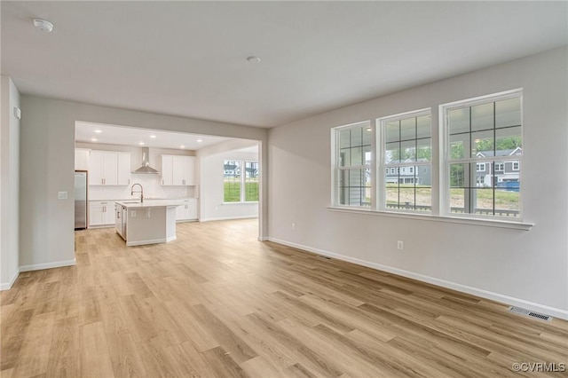 7127 Braxton Ct, Ladysmith, VA 22546 - unfurnished living room featuring light wood-type flooring and recessed lighting