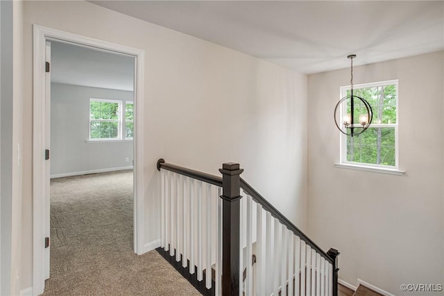 7127 Braxton Ct, Ladysmith, VA 22546 - staircase with a chandelier and carpet floors