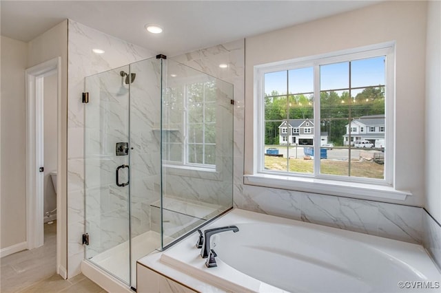 7127 Braxton Ct, Ladysmith, VA 22546 - full bathroom featuring plenty of natural light, a garden tub, a marble finish shower, and recessed lighting