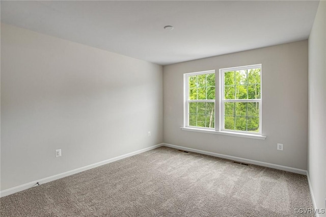 7127 Braxton Ct, Ladysmith, VA 22546 - carpeted empty room with baseboards