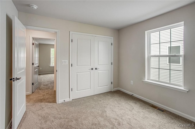 7127 Braxton Ct, Ladysmith, VA 22546 - unfurnished bedroom featuring carpet floors and a closet
