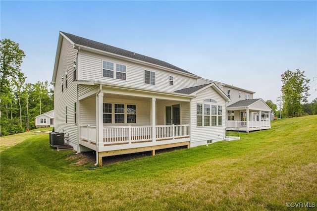 7127 Braxton Ct, Ladysmith, VA 22546 - rear view of house featuring a yard