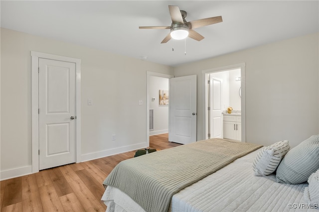 407 S 19th Ave, Hopewell, VA 23860 - bedroom featuring light wood-style flooring, connected bathroom, and a ceiling fan