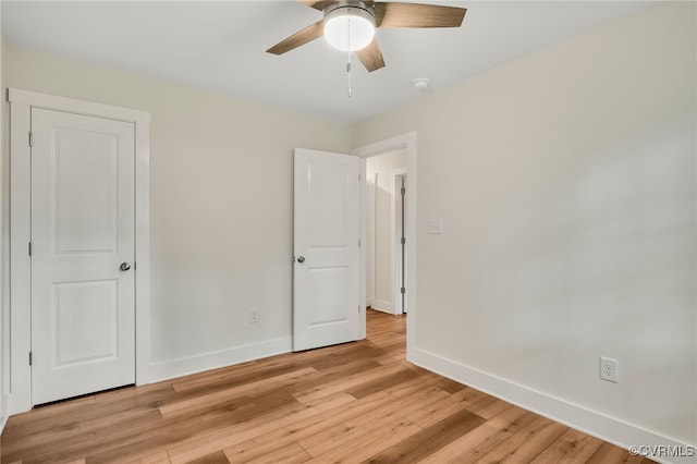 407 S 19th Ave, Hopewell, VA 23860 - unfurnished bedroom featuring light wood-style flooring and ceiling fan