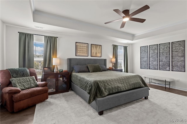 10109 Hollythorne Ln, Mechanicsville, VA 23116 - bedroom with a raised ceiling, multiple windows, crown molding, a ceiling fan, and wood finished floors