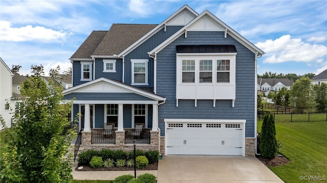 10109 Hollythorne Ln, Mechanicsville, VA 23116 - craftsman-style home featuring covered porch, driveway, stone siding, an attached garage, and a standing seam roof