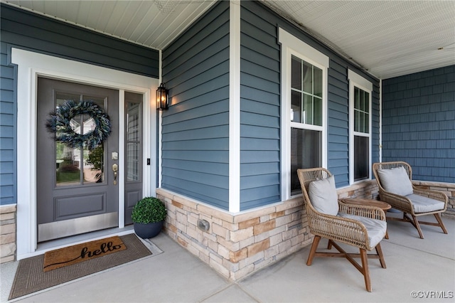 10109 Hollythorne Ln, Mechanicsville, VA 23116 - view of exterior entry featuring a porch and stone siding