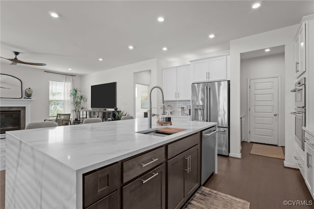 10109 Hollythorne Ln, Mechanicsville, VA 23116 - kitchen with open floor plan, ceiling fan, stainless steel appliances, white cabinets, and recessed lighting