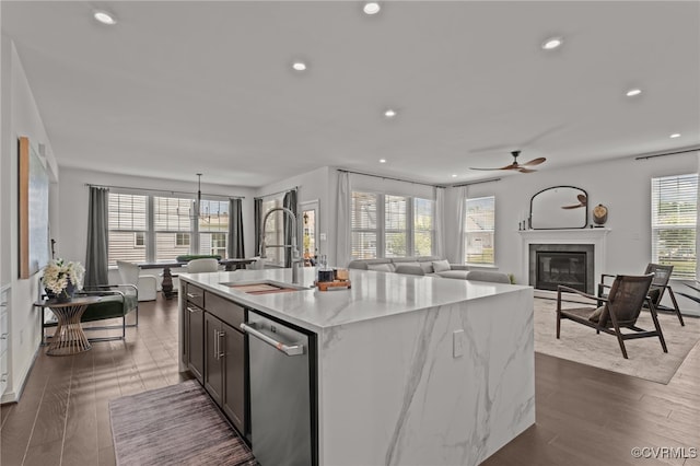 10109 Hollythorne Ln, Mechanicsville, VA 23116 - kitchen with stainless steel dishwasher, recessed lighting, a ceiling fan, an island with sink, and light stone counters