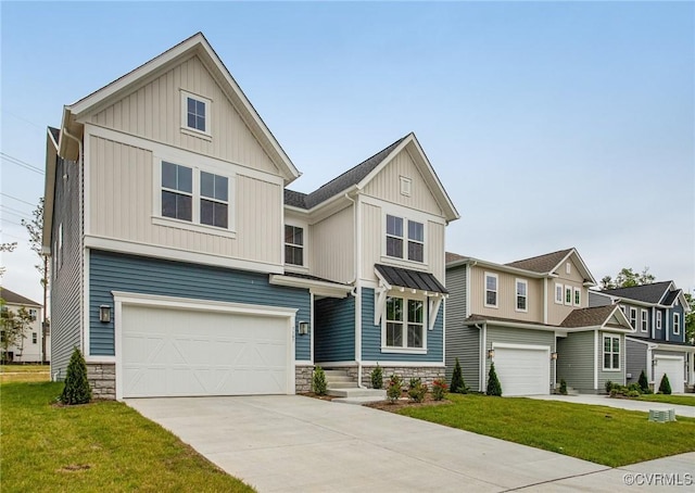7107 Braxton Ct, Ladysmith, VA 22546 - view of front facade with a garage, concrete driveway, a front lawn, and board and batten siding