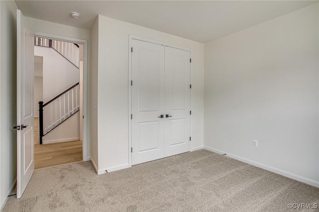 7107 Braxton Ct, Ladysmith, VA 22546 - unfurnished bedroom featuring carpet flooring and a closet
