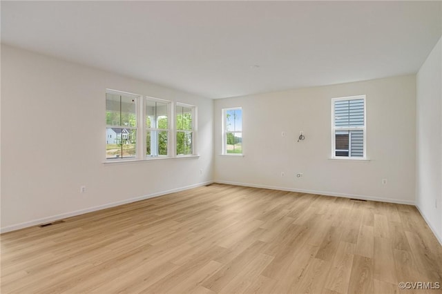 7107 Braxton Ct, Ladysmith, VA 22546 - unfurnished room with plenty of natural light and light wood-style flooring