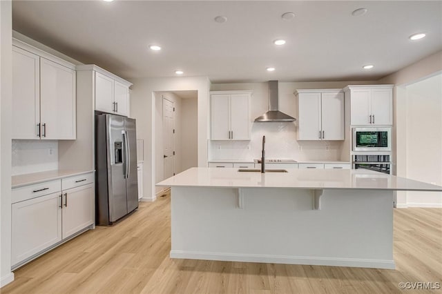 7107 Braxton Ct, Ladysmith, VA 22546 - kitchen with wall chimney exhaust hood, stainless steel fridge, built in microwave, oven, and light countertops