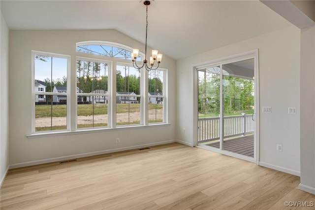 7107 Braxton Ct, Ladysmith, VA 22546 - unfurnished dining area featuring light wood-type flooring, a chandelier, and lofted ceiling