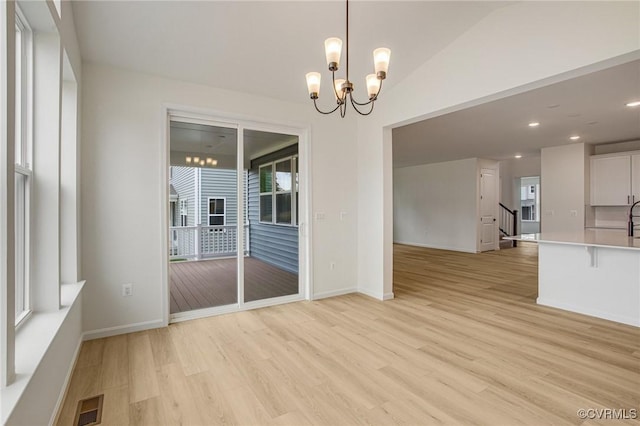 7107 Braxton Ct, Ladysmith, VA 22546 - spare room featuring light wood-style floors, a chandelier, and recessed lighting