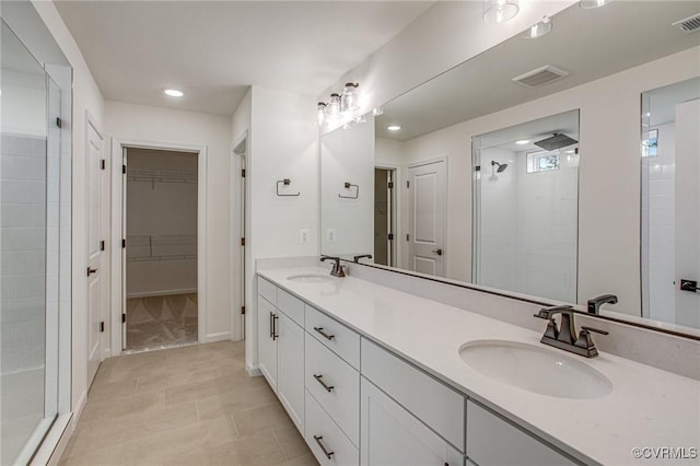 7107 Braxton Ct, Ladysmith, VA 22546 - full bathroom with a shower stall, double vanity, a walk in closet, recessed lighting, and tile patterned floors