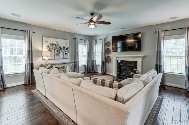 5025 Ellis Meadows Ct, Glen Allen, VA 23059 - living room featuring a glass covered fireplace, a ceiling fan, and dark wood finished floors