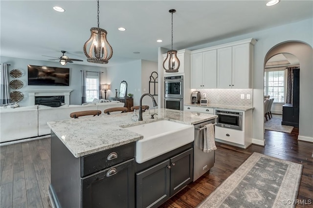 5025 Ellis Meadows Ct, Glen Allen, VA 23059 - kitchen with appliances with stainless steel finishes, arched walkways, white cabinets, ceiling fan, and recessed lighting