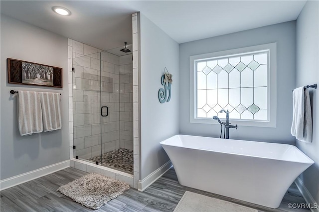 5025 Ellis Meadows Ct, Glen Allen, VA 23059 - bathroom with a shower stall, a freestanding bath, wood finished floors, and recessed lighting