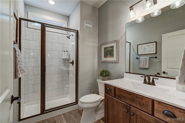 5025 Ellis Meadows Ct, Glen Allen, VA 23059 - bathroom featuring vanity, a shower stall, and wood finished floors