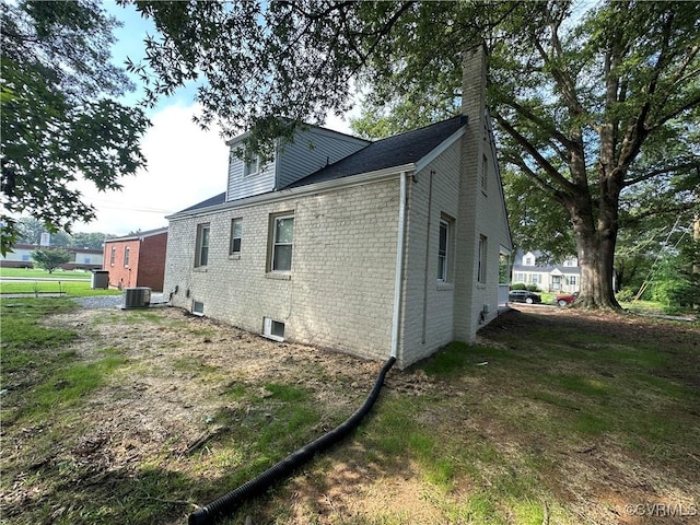 1883 Fairfax St, Petersburg, VA 23805 - view of property exterior with a chimney and brick siding