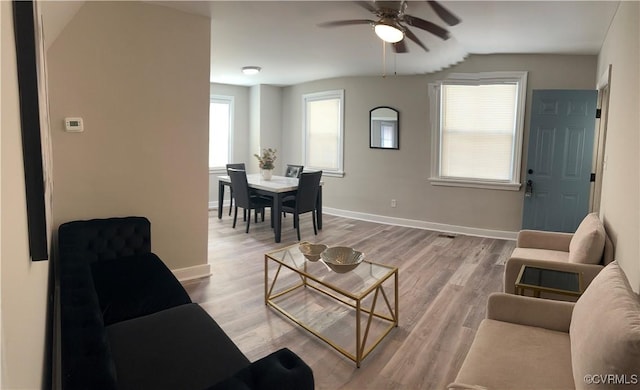 1883 Fairfax St, Petersburg, VA 23805 - living room featuring ceiling fan, light wood-style flooring, plenty of natural light, and vaulted ceiling