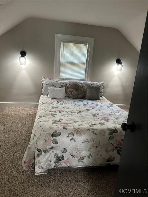 1883 Fairfax St, Petersburg, VA 23805 - carpeted bedroom with lofted ceiling and baseboards