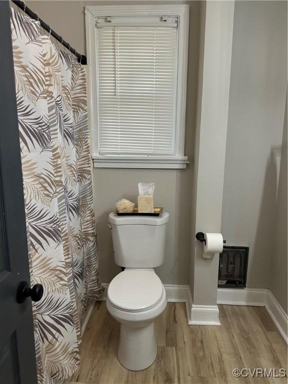 1883 Fairfax St, Petersburg, VA 23805 - full bath featuring wood finished floors and a shower with curtain