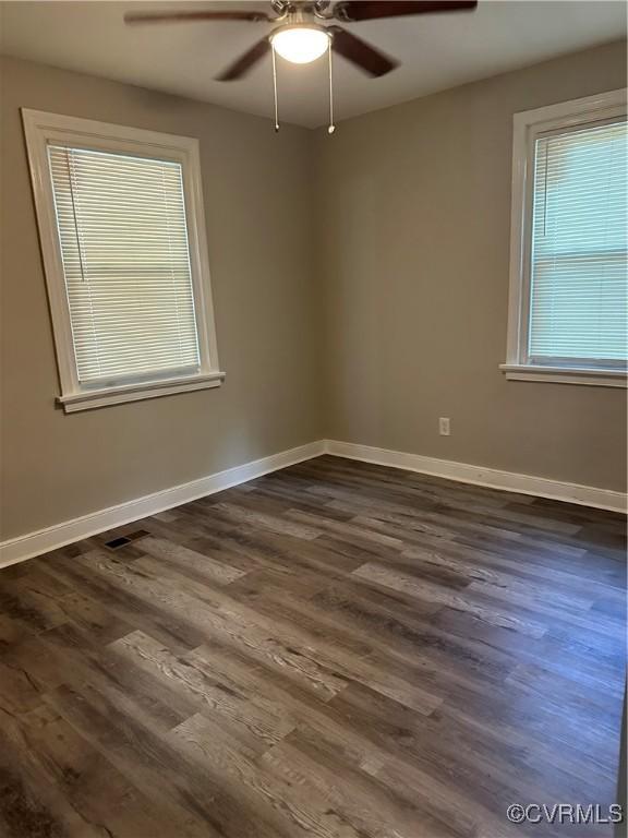 1883 Fairfax St, Petersburg, VA 23805 - unfurnished room with a ceiling fan and dark wood finished floors