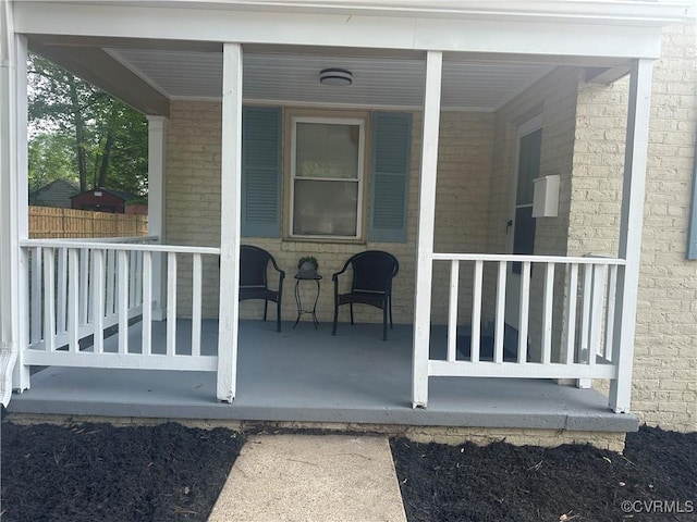 1883 Fairfax St, Petersburg, VA 23805 - property entrance featuring covered porch and brick siding
