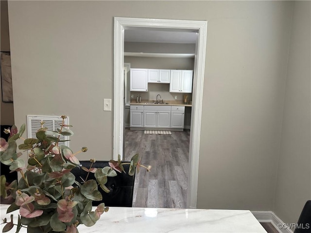 1883 Fairfax St, Petersburg, VA 23805 - corridor with a sink and wood finished floors