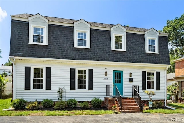 6213 Monument Ave, Richmond, VA 23226 - colonial inspired home with roof with shingles, mansard roof, entry steps, and crawl space