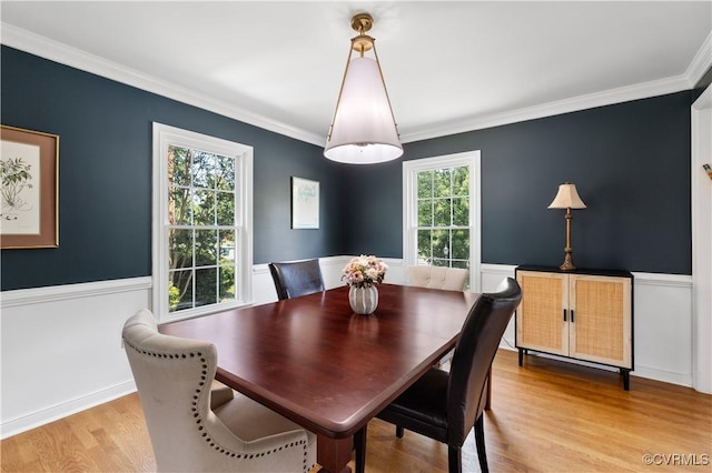 6213 Monument Ave, Richmond, VA 23226 - dining room with light wood-style floors, crown molding, and wainscoting