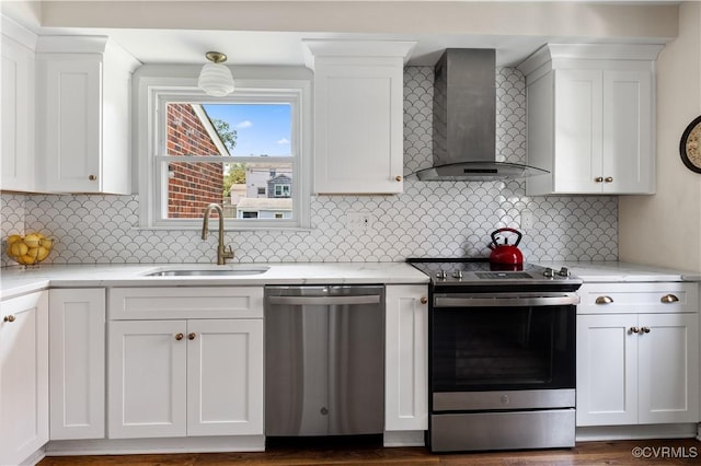 6213 Monument Ave, Richmond, VA 23226 - kitchen with stainless steel appliances, wall chimney exhaust hood, white cabinets, and backsplash