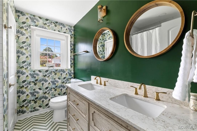 6213 Monument Ave, Richmond, VA 23226 - bathroom featuring wallpapered walls, double vanity, and a shower with curtain