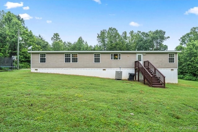 4627 Powhatan Lakes Rd Unit B, Powhatan, VA 23139 - rear view of house with a trampoline, a lawn, and stairs