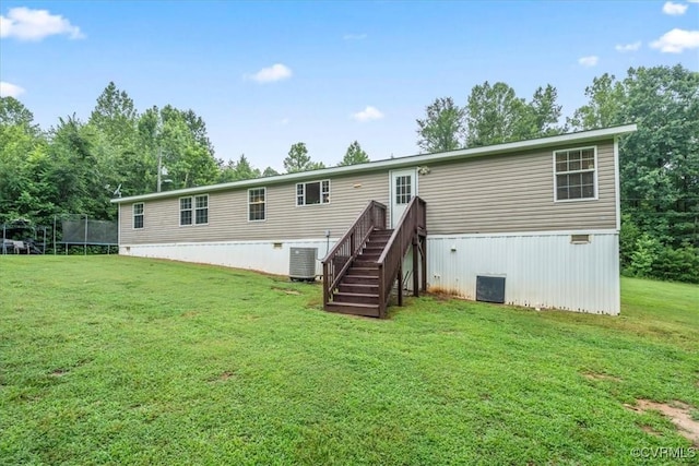 4627 Powhatan Lakes Rd Unit B, Powhatan, VA 23139 - rear view of house with a trampoline, a yard, and stairs